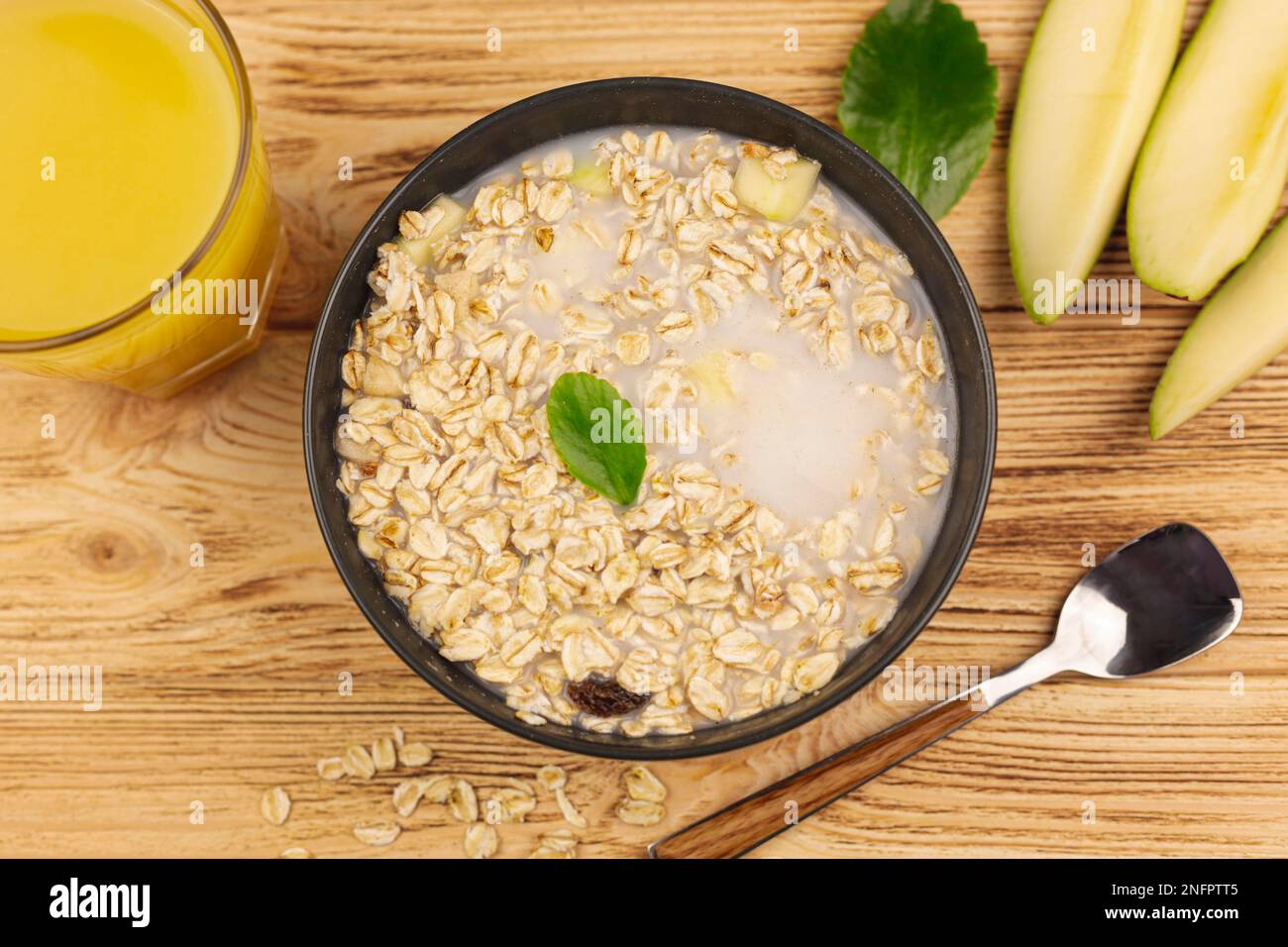 oatmeal porridge bowl with cup orange juice Stock Photo Alamy