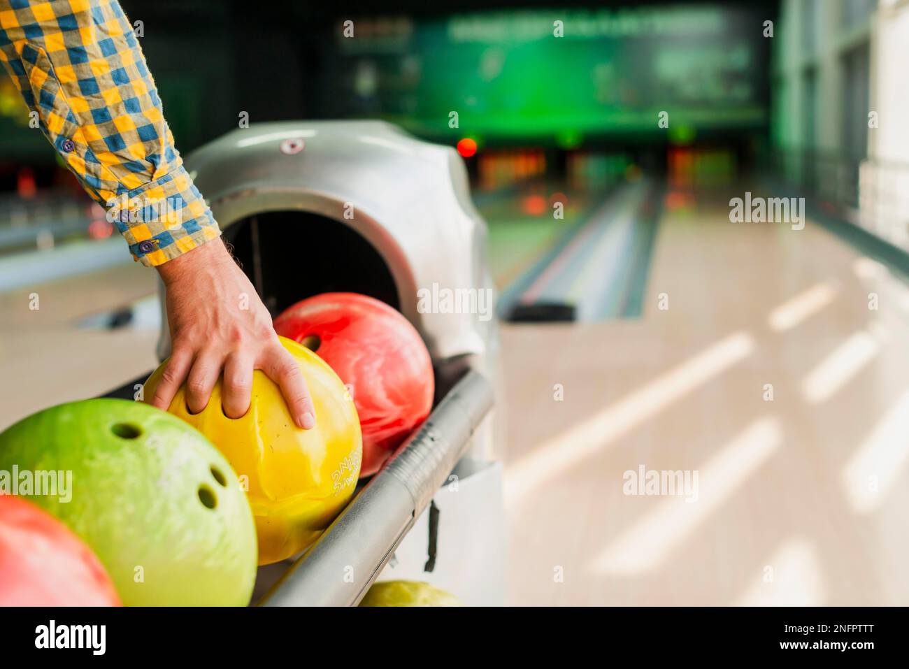 person taking bowling ball Stock Photo