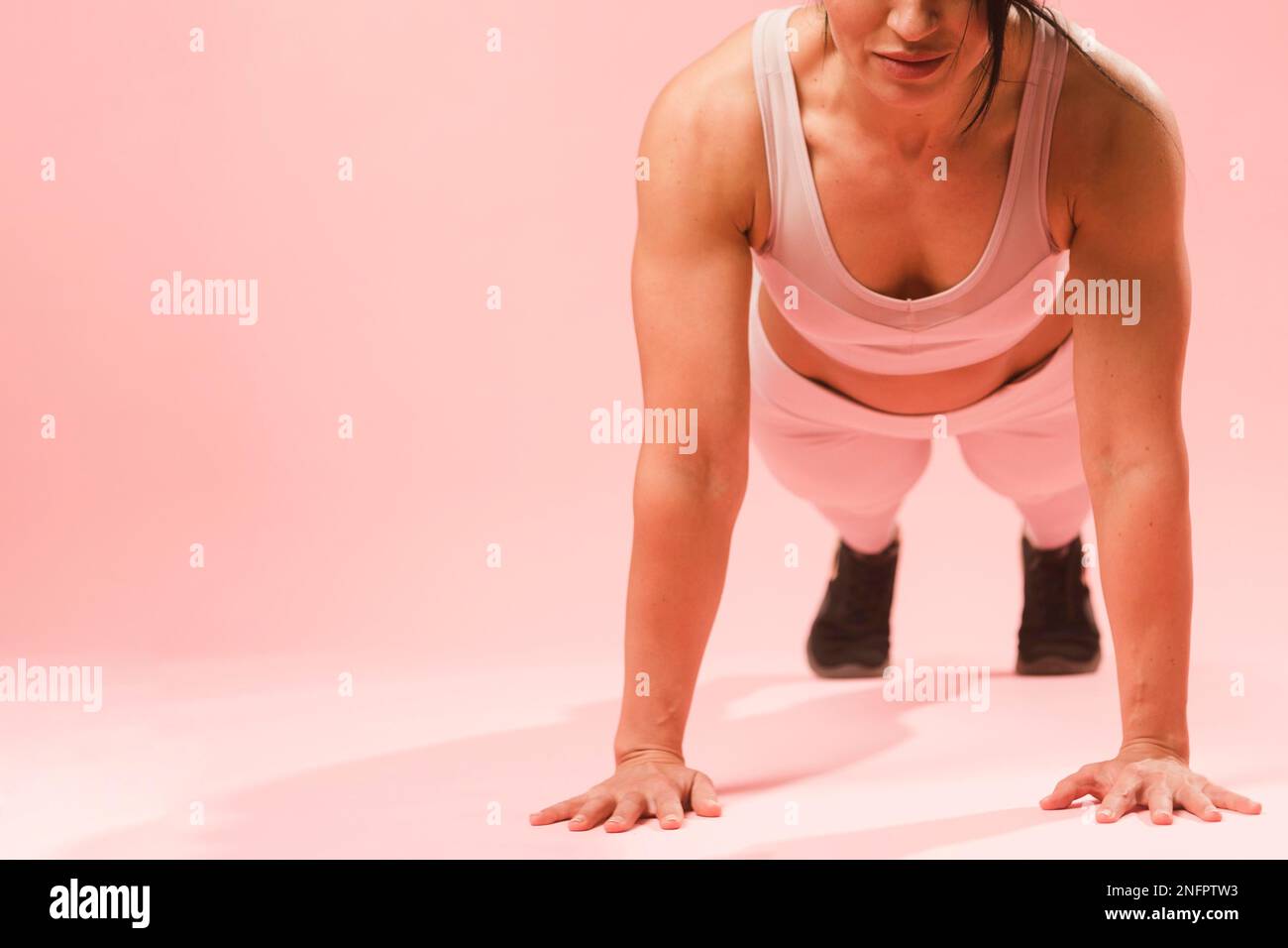 athletic woman doing push up Stock Photo