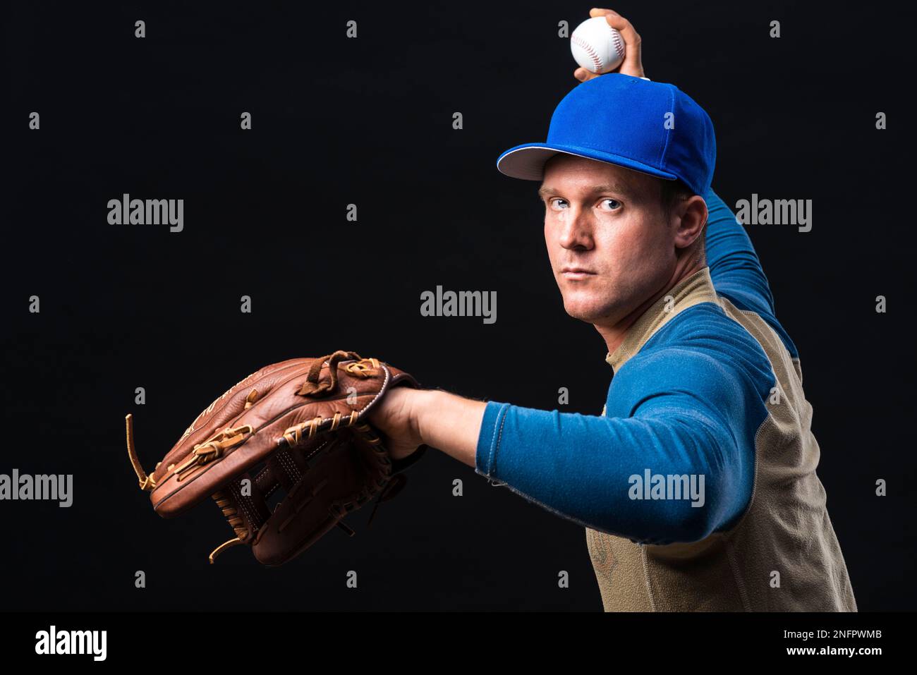Baseball player with glove throwing ball Stock Photo Alamy