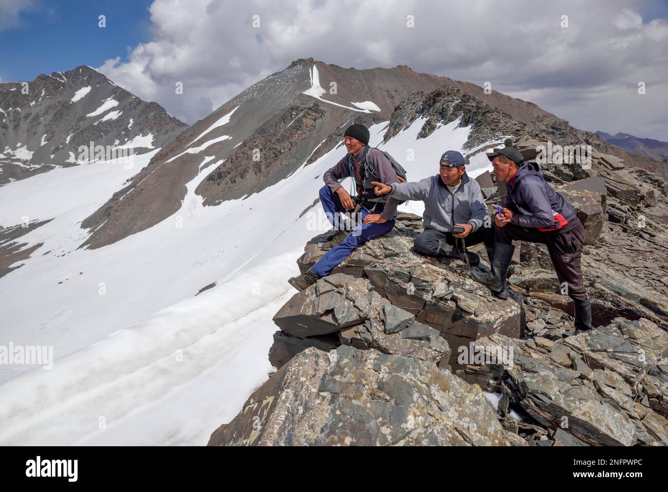 Local hikers on a ridge above the West Karakol Valley, Tian Shan ...