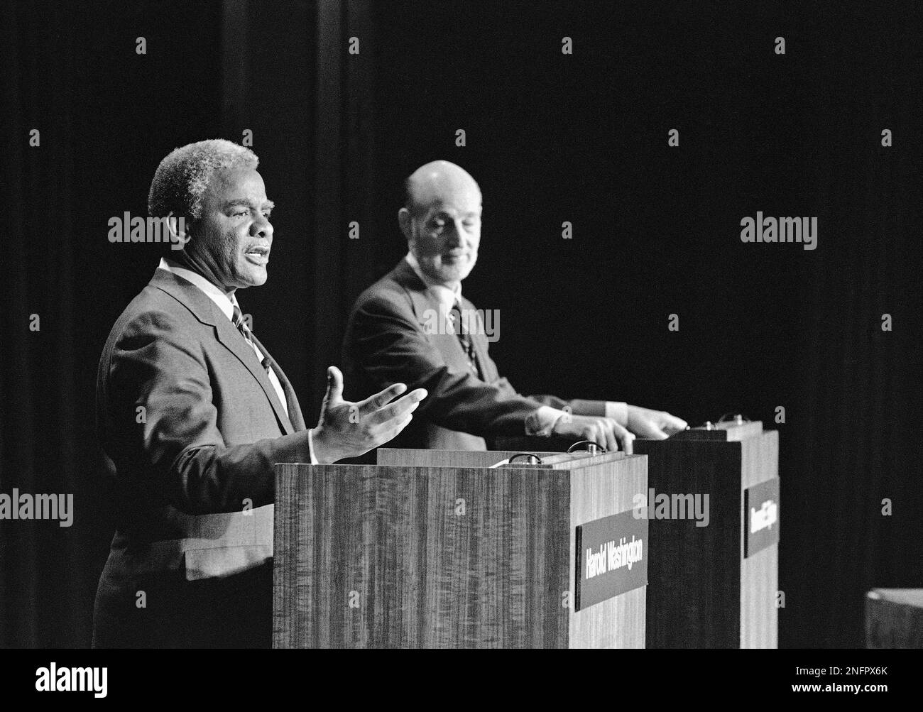 During the Chicago mayoral debate held on Monday, March 21,1983 in Chicago, Democratic Nominee Harold Washington, left, responds to a question and republican nominee, Bernard Epton, awaits his turn to reply. (AP Photo/Jim Bourdier) Stock Photo