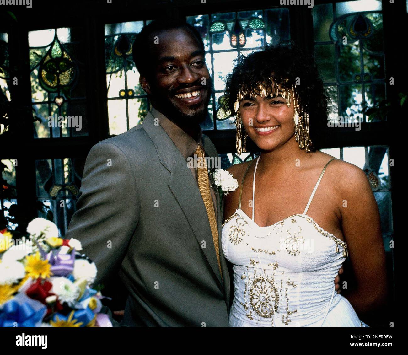 American track and field star Edwin Moses is shown with his new bride