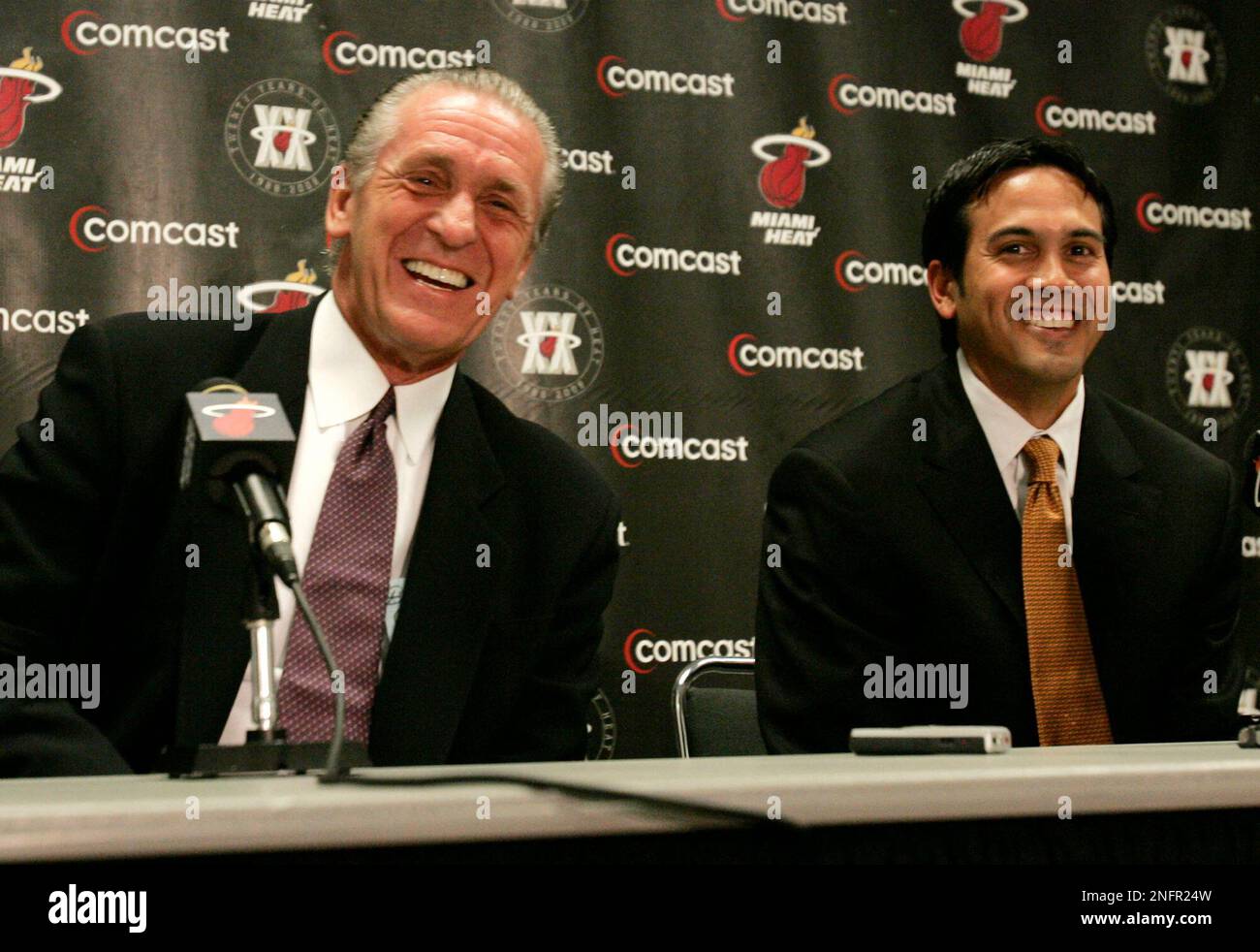 Miami Heat head coach Erik Spoelstra, right, presents a 2011-12