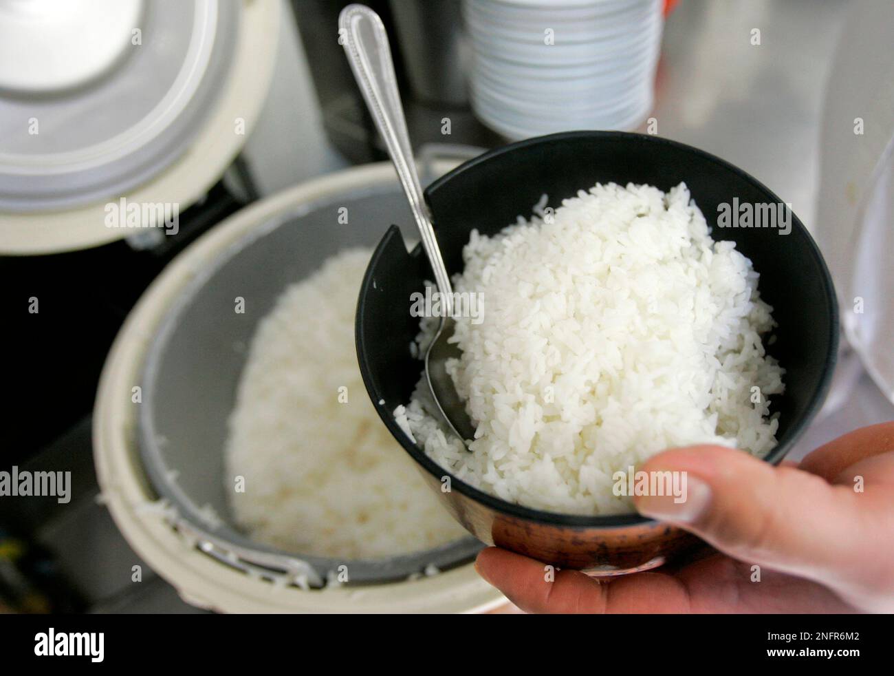 Frank Chu, manager of San Tung Chinese restaurant, scoops a bowl of