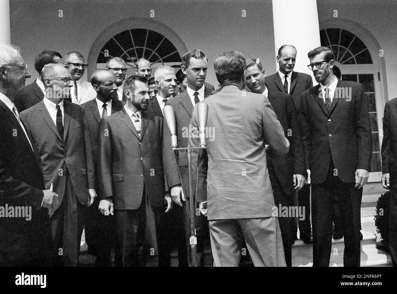 President John Kennedy shakes hands with members of the American