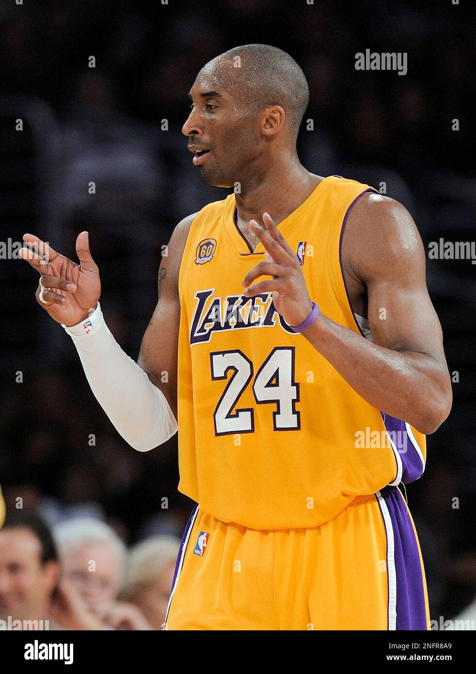 Los Angeles Lakers guard Kobe Bryant 24 mimcs a gun slinger after scoring a three point basket against Denver Nuggets during the fourth quarter of Game 2 of an NBA basketball first round