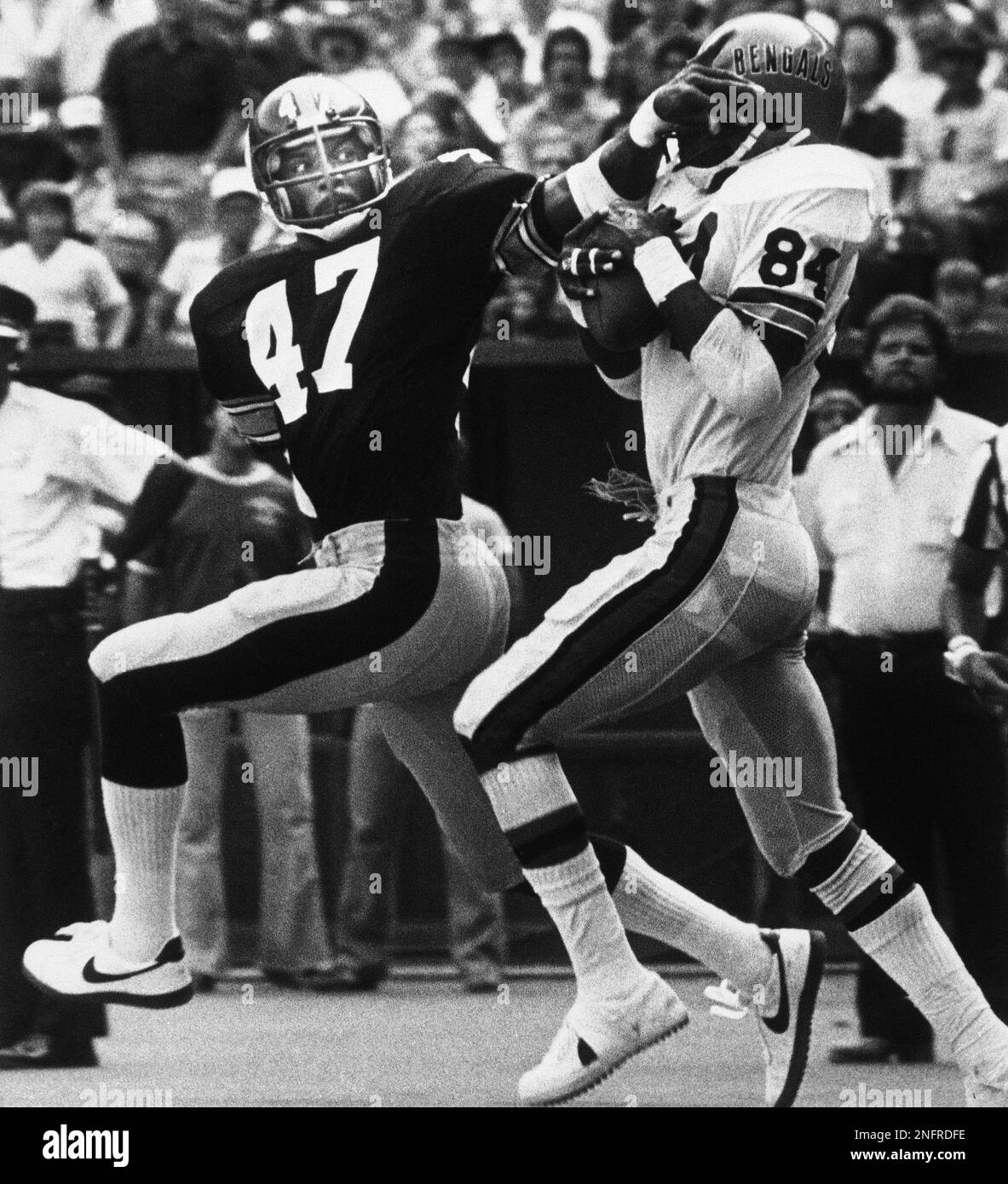 Pittsburgh Steelers' Mel Blount tries to keep Cincinnati Bengals' Don Bass  from seeing the action as Blount grabs the 22 yard touchdown pass  regardless of Blount's attempts, Sept. 21, 1980. (AP Photo