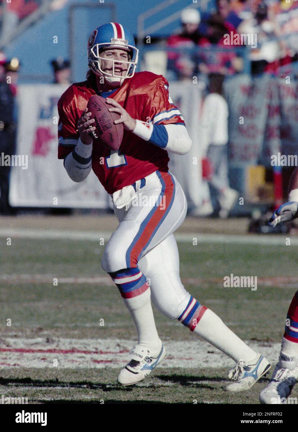 John Elway, Denver Broncos quarterback, prepares to throw the ball