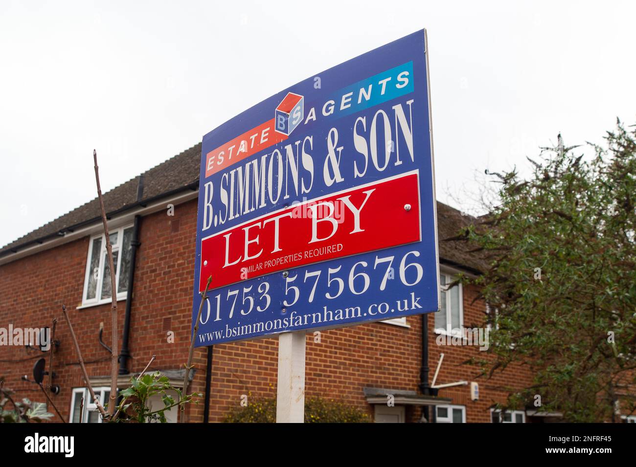 Slough, Berkshire, UK. 17th February, 2023. A Let By sign outside a maisonette in Slough Town Centre, Berkshire. It has been reported in the press today that UK house prices could fall by as much as 40%. The number of buyers is begining to dry up as people are concerned about buying homes if the prices are to fall, whereas meanwhile, those selling properties don't want to reduce the price. Experts are predicting house prices could take a massive fall as they did in the 1990s when many people found themselves in a negative equity situation. Credit: Maureen McLean/Alamy Live News Stock Photo