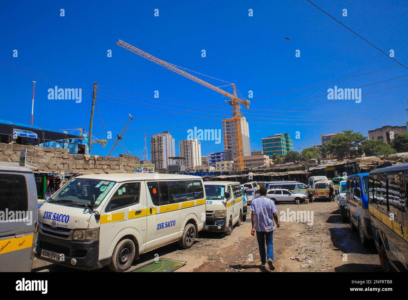 Public service vehicles parked by the roadside in Central Business