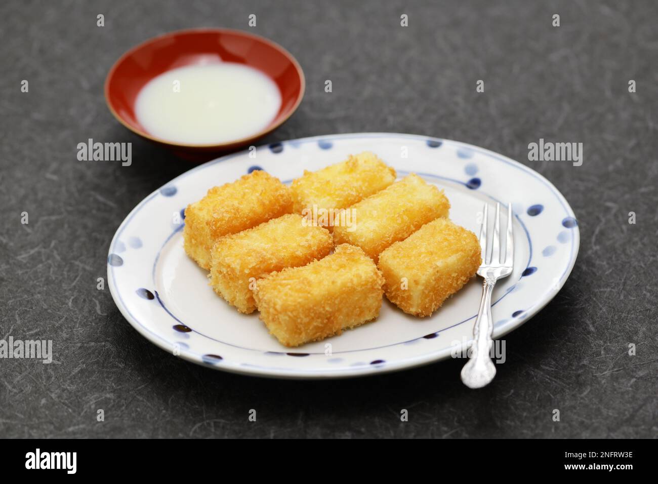 crispy fried milk with condensed milk, Chinese dessert Stock Photo