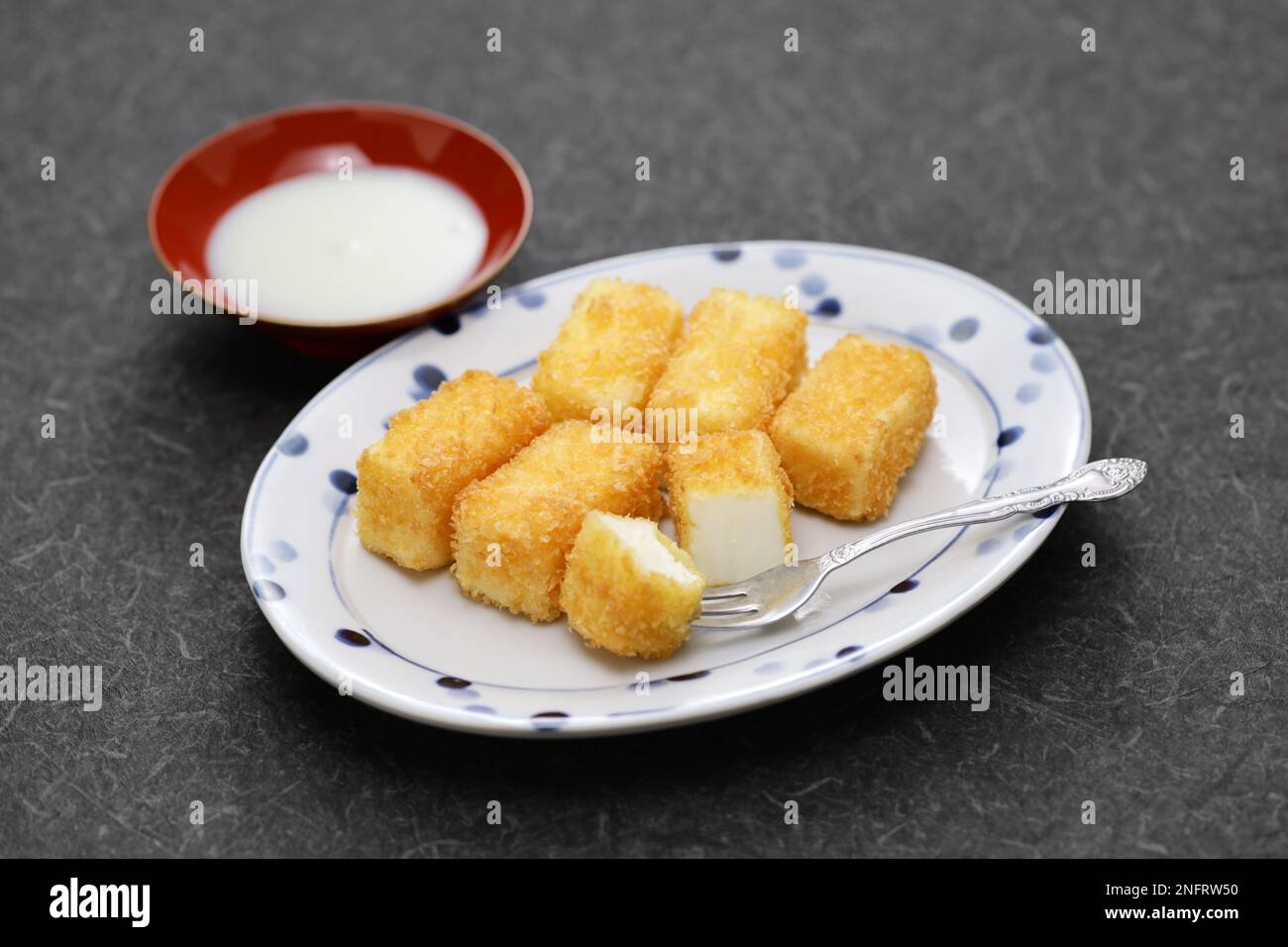 crispy fried milk with condensed milk, Chinese dessert Stock Photo