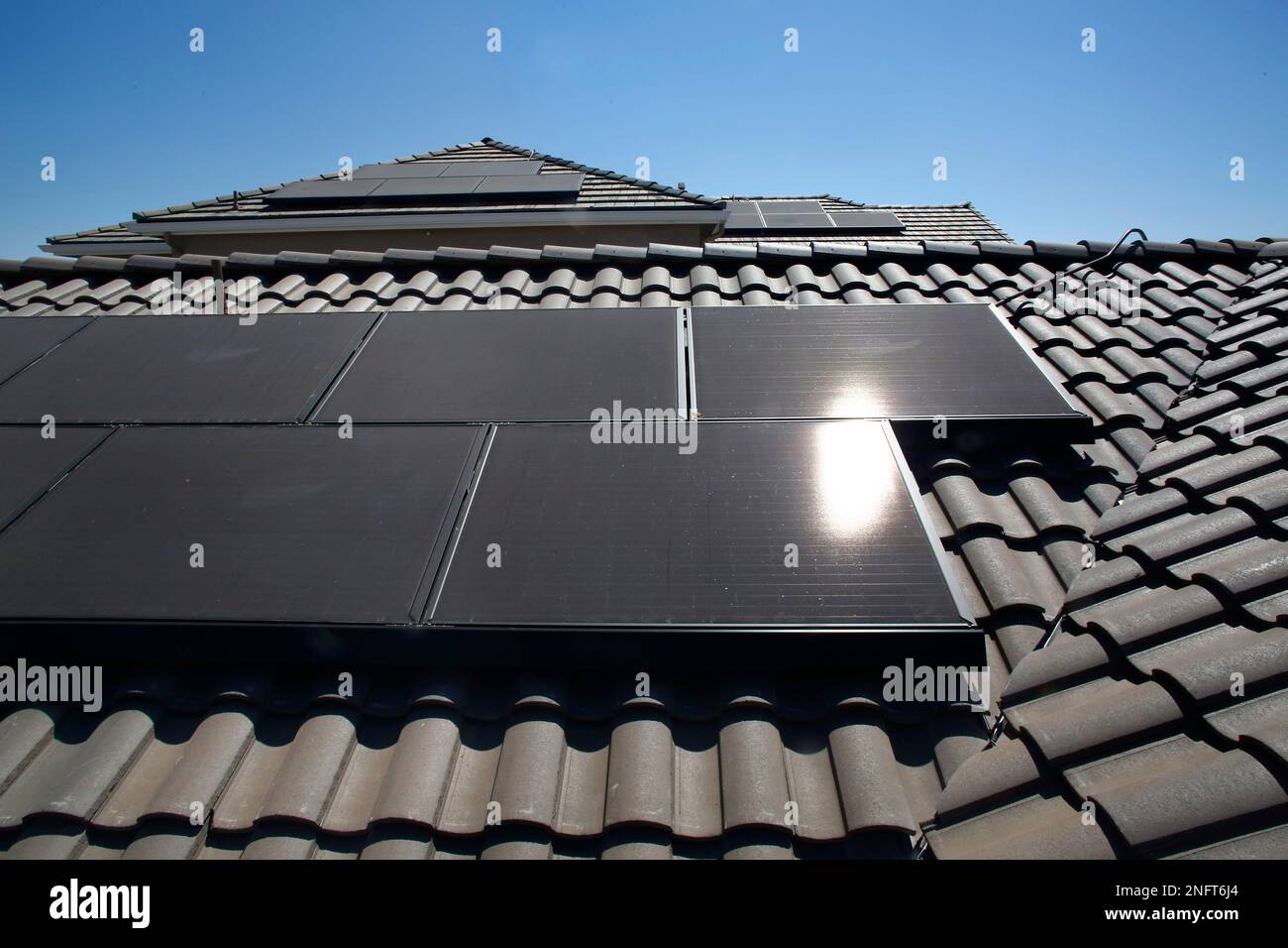 Solar panels are installed on the roofs of zero energy model homes, as