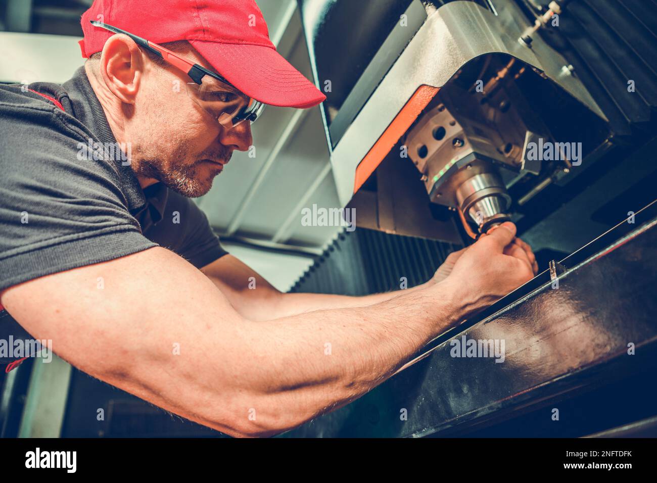 Professional CNC Laser Machine Operator Performing Equipment Cutting ...