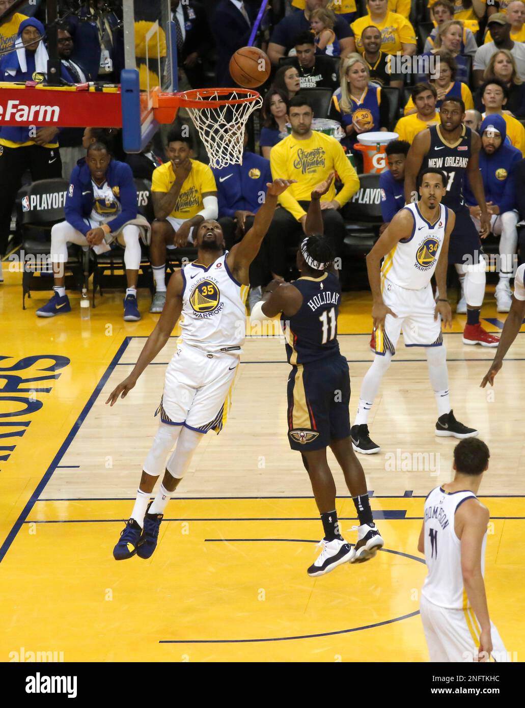 Warriors Kevin Durant 35 defends against Pelicans Jrue Holiday 11 in the third quarter as the Golden State Warriors went on to beat the New Orleans Pelicans 123 101 in game one of the second