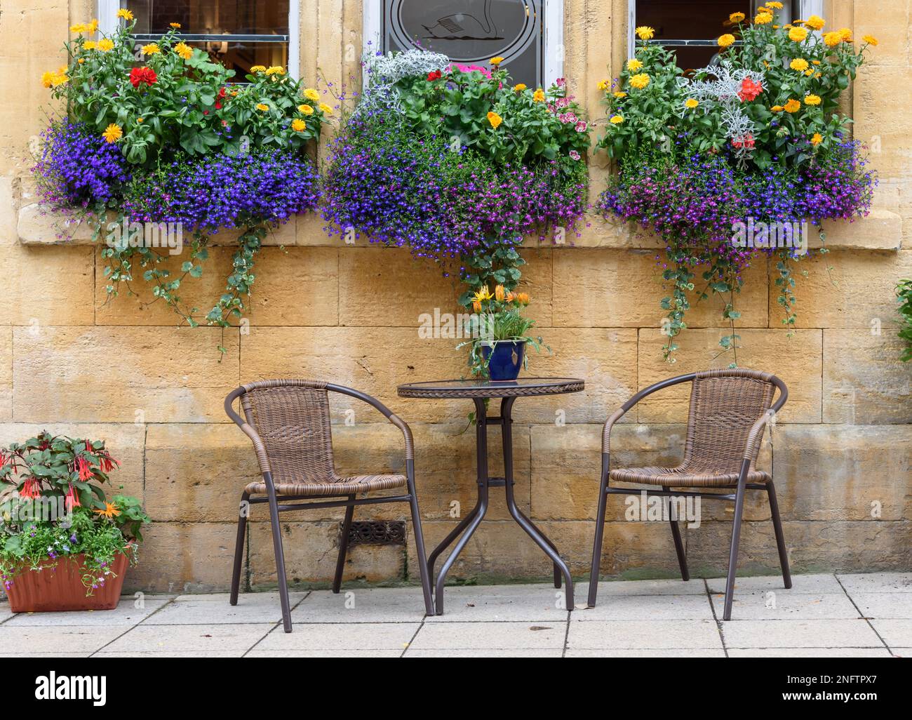 Seats arrangement with flower décor in background Stock Photo