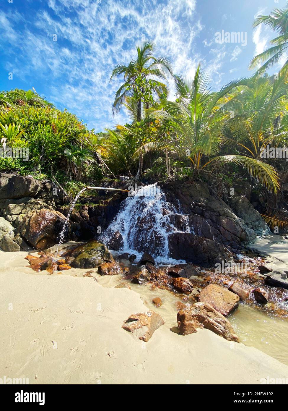 Waterfall on the beach of Itacarezinho in the Municipality of Itacaré, south of the state of Bahia, Northeast Brazil. Stock Photo
