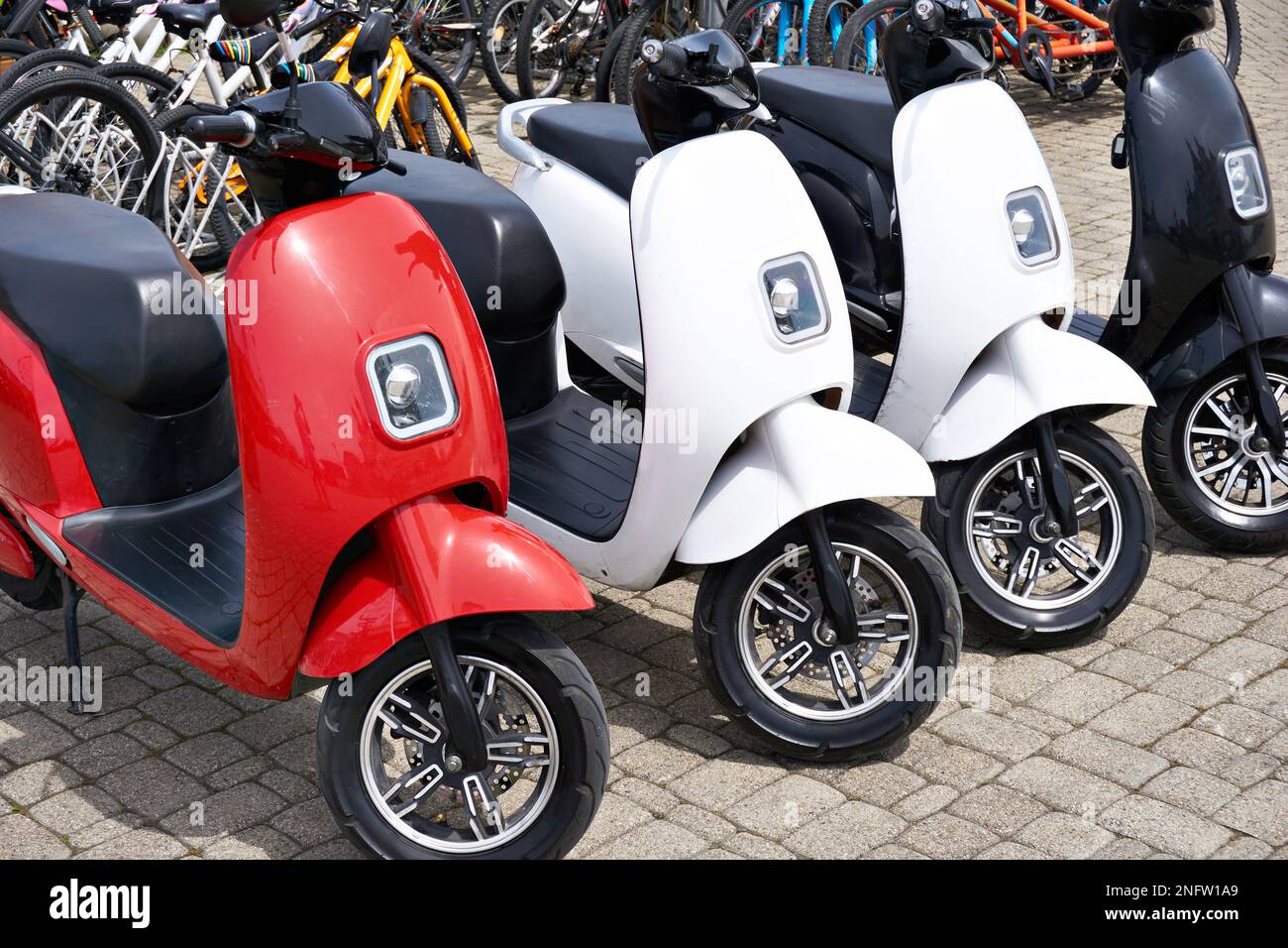 Electric scooters for rent in the parking lot in sunny weather Stock