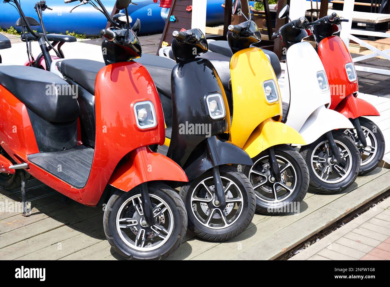Electric scooters for rent in the parking lot in sunny weather Stock