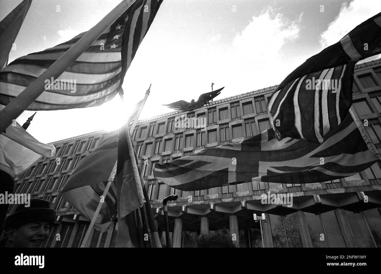 Flags of the United States and the United Kingdom are carried by pro ...