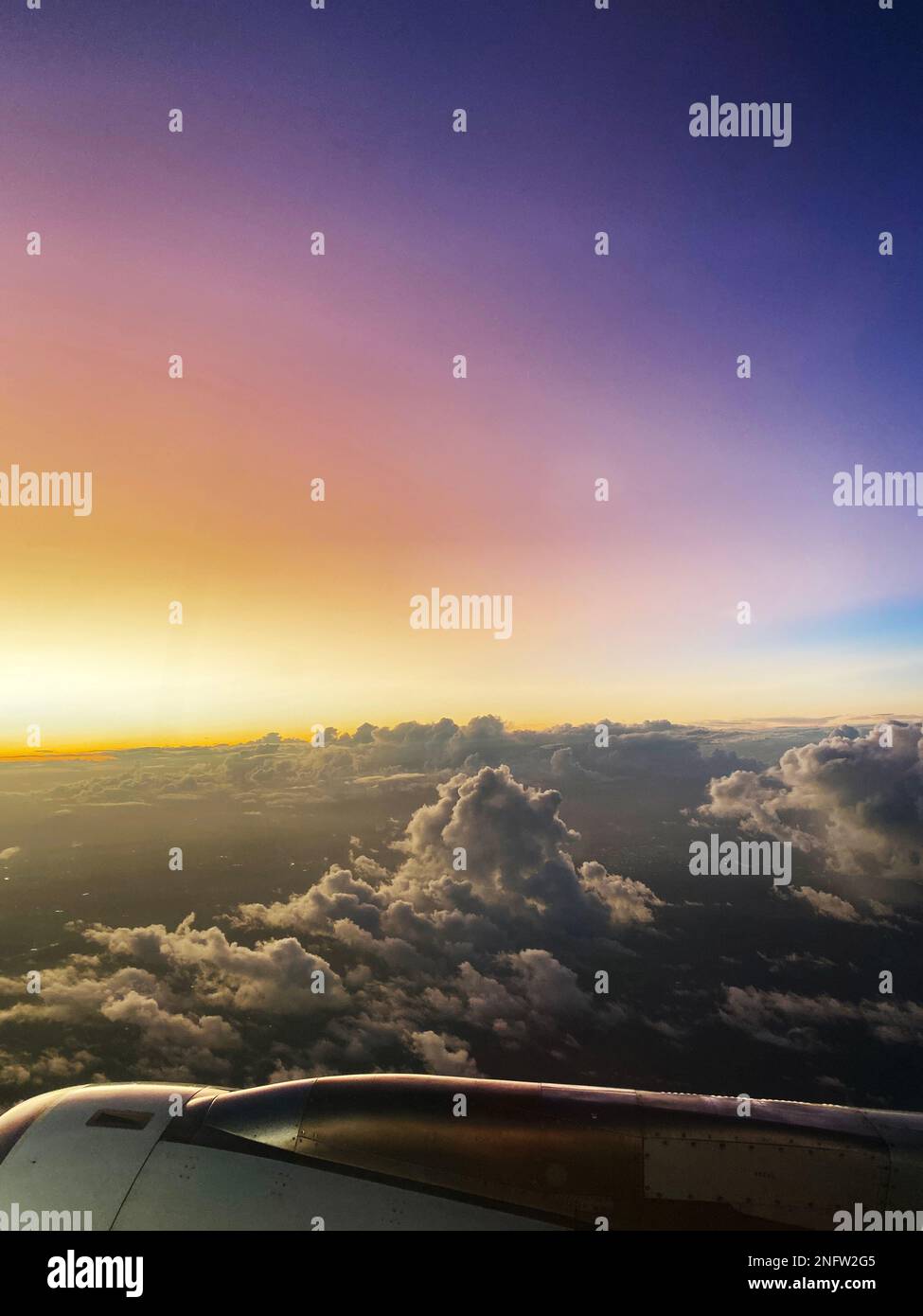 Sunset through the airplane window. Stock Photo