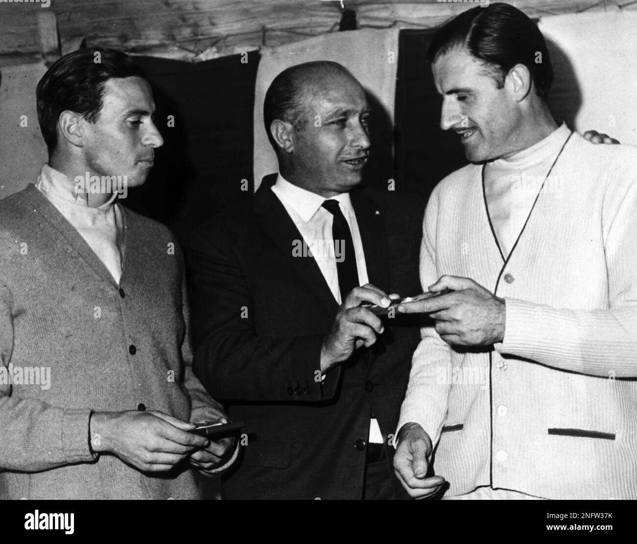 British auto racers Jim Clark, left, and Graham Hill are presented with ...