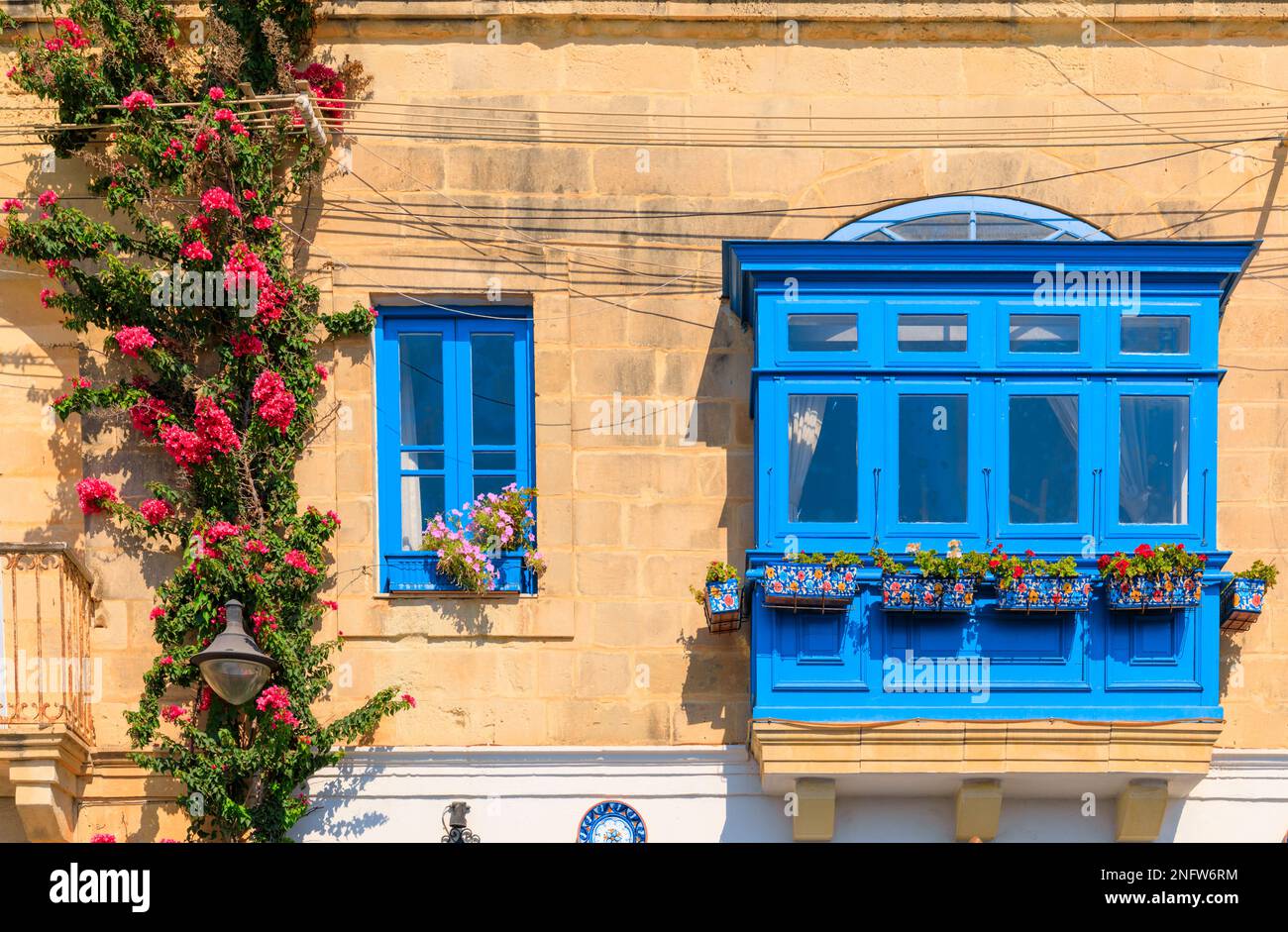 Balcony in Malta: Maltese Gallarija, traditional enclosed wooden balcony, ornate closed wooden balcony. Stock Photo