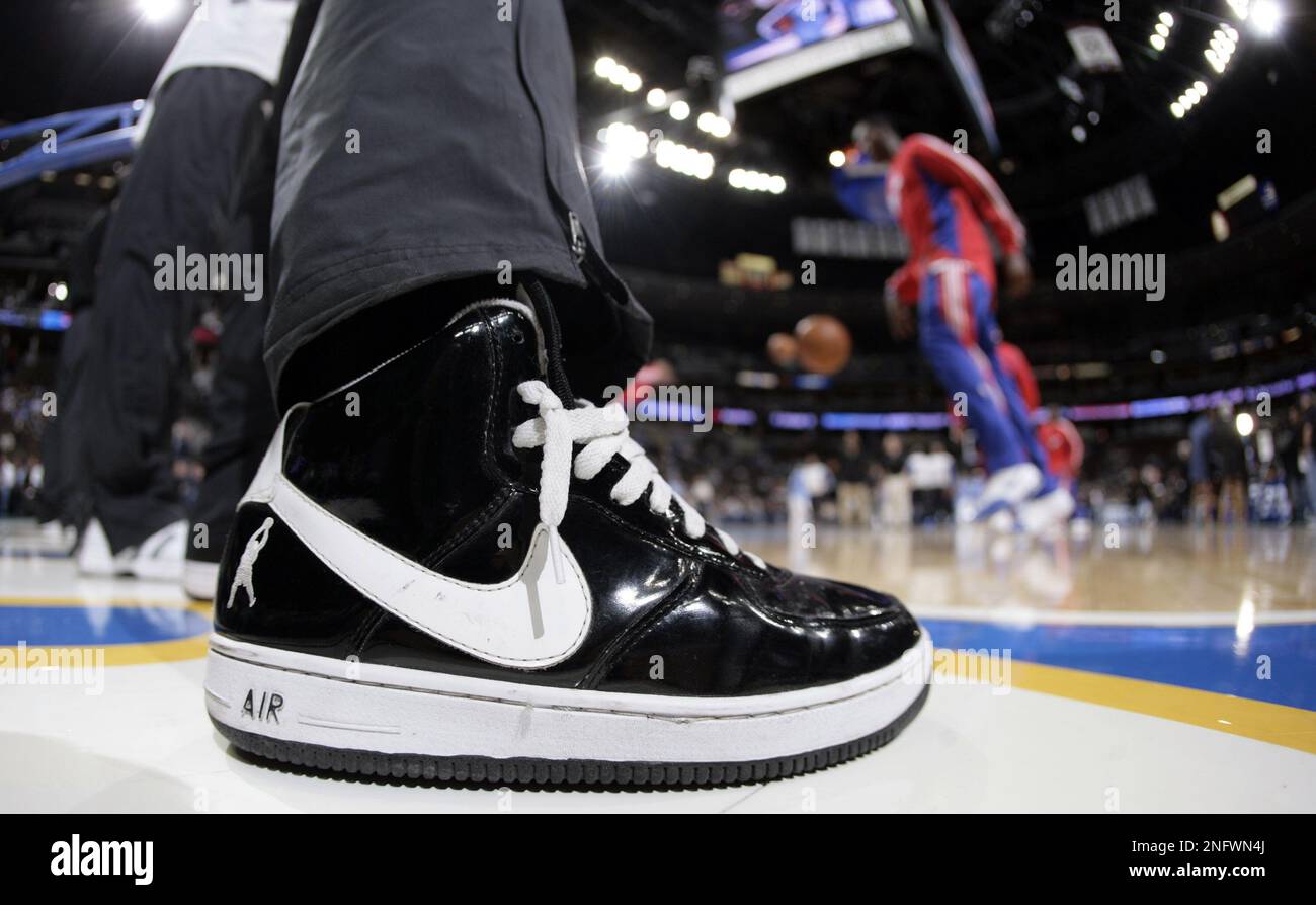 A ballboy wears a pair of Nike Air Force One high basketball shoes while helping with the on court needs of the Los Angeles Clippers and the Denver Nuggets in the first quarter