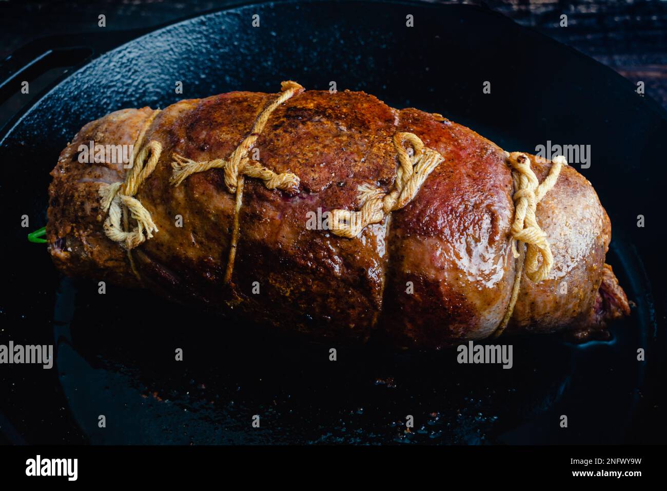 Whole Stuffed Flank Steak with Prosciutto and Mushrooms in a Pan