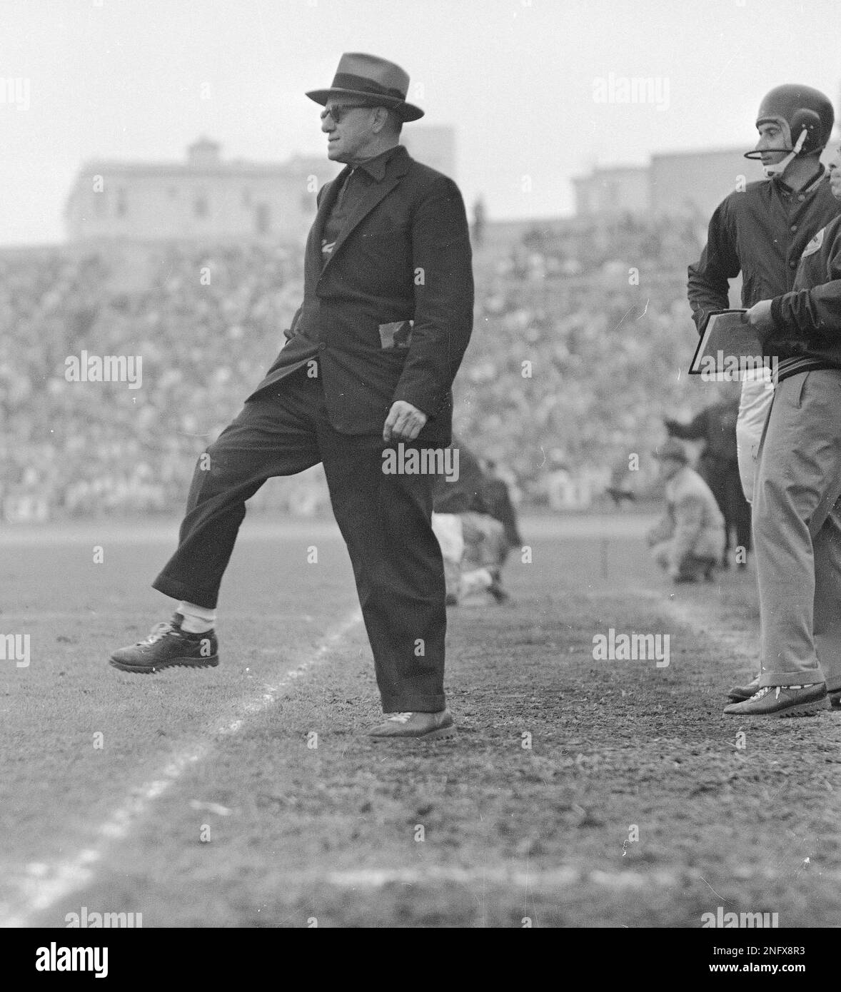 Owner-coach George Halas of the Chicago Bears announced the election of his  son George Mugs Halas Jr., 38 and shown at his desk in Chicago, as  president and general manager of the