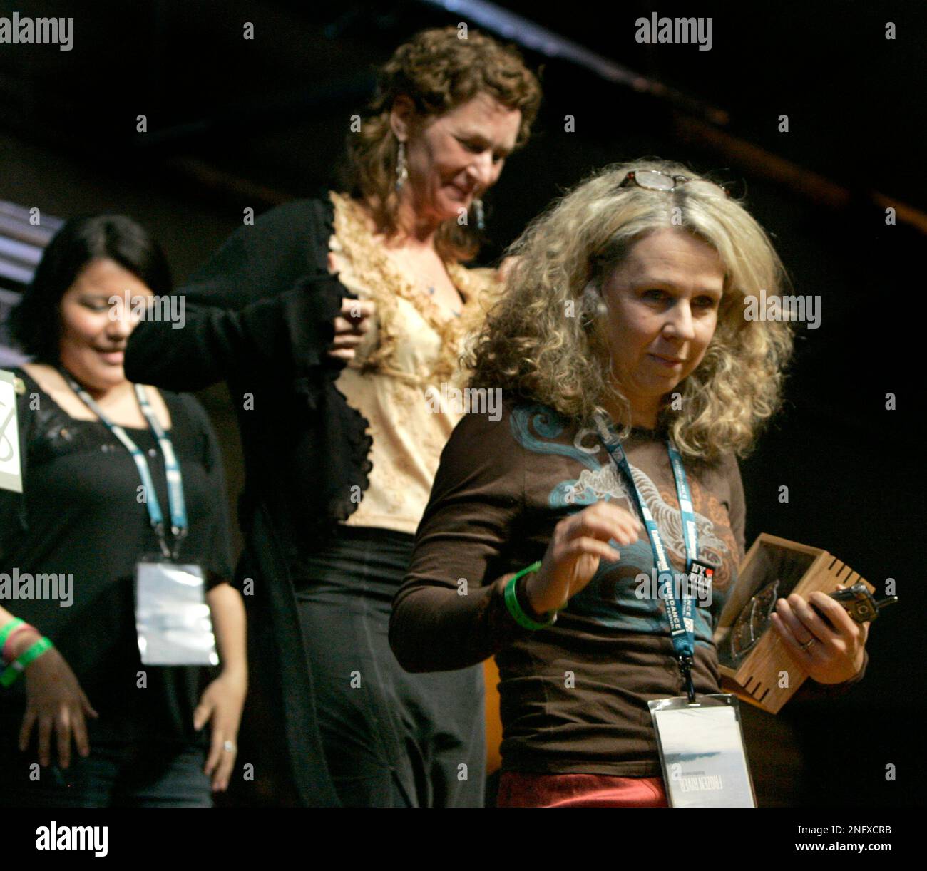 Director Courtney Hunt, right, leaves the stage after she was awarded
