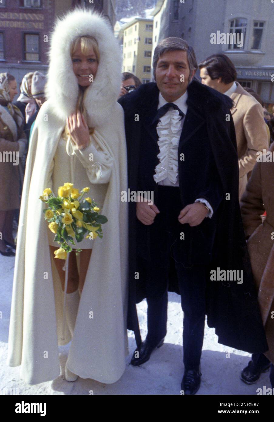 West German playboy Gunter Sachs, wearing a dracula costume and his wife to  be, Mirja Larsson sporting a white mini dress and a white cape with a white  fur collar, holding a