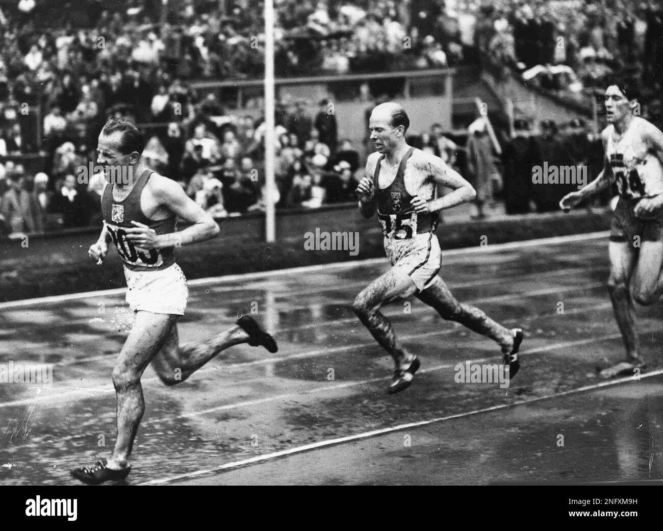 Czechoslovakia's Emil Zatopek Gets A Helping Hand From Yugoslavian Athletes After He Won The Mens 10000 Metres Olympic Games Race In Wembley Stadium London July 30 1948 Ap Photo 2nfxn33
