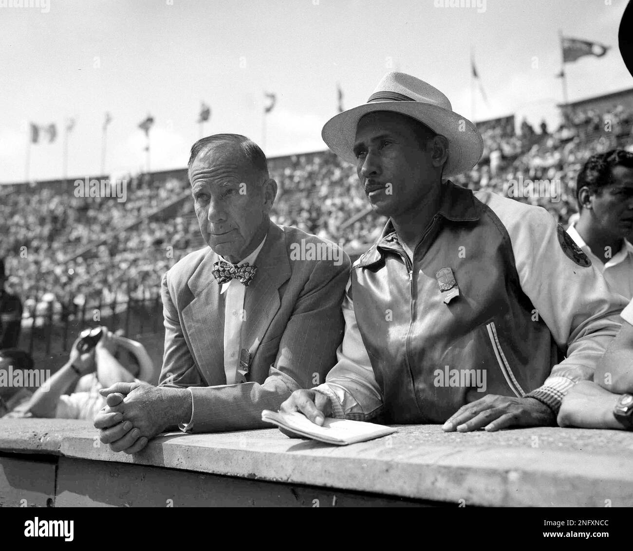 American head coach Dean Cromwell, left, and track and field coach