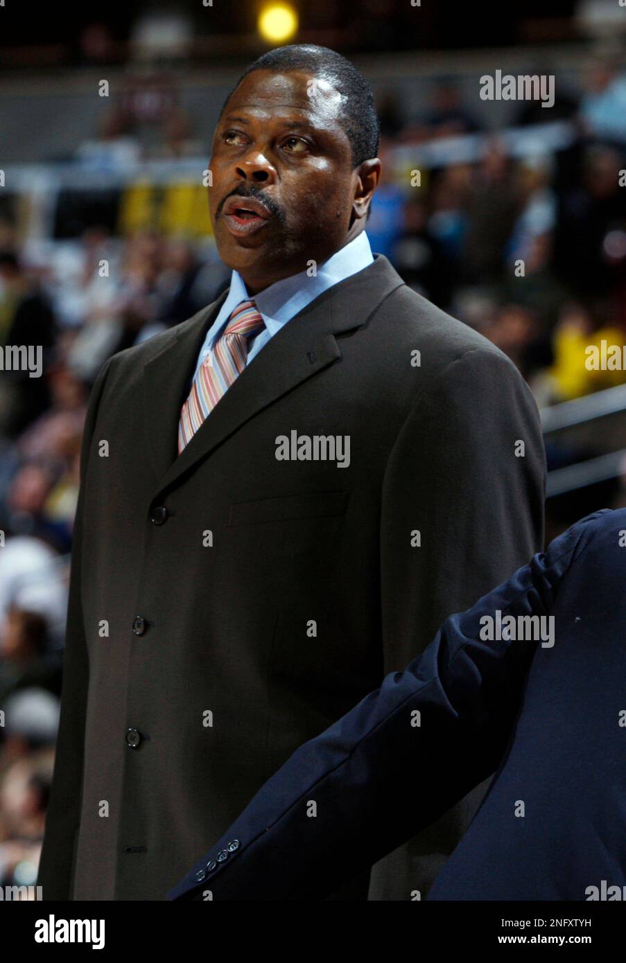 Orlando Magic assistant coach Patrick Ewing looks on against the Denver  Nuggets in the first quarter of an NBA basketball game in Denver on Friday,  Jan. 11, 2008. (AP Photo/David Zalubowski Stock, image size:903x1390