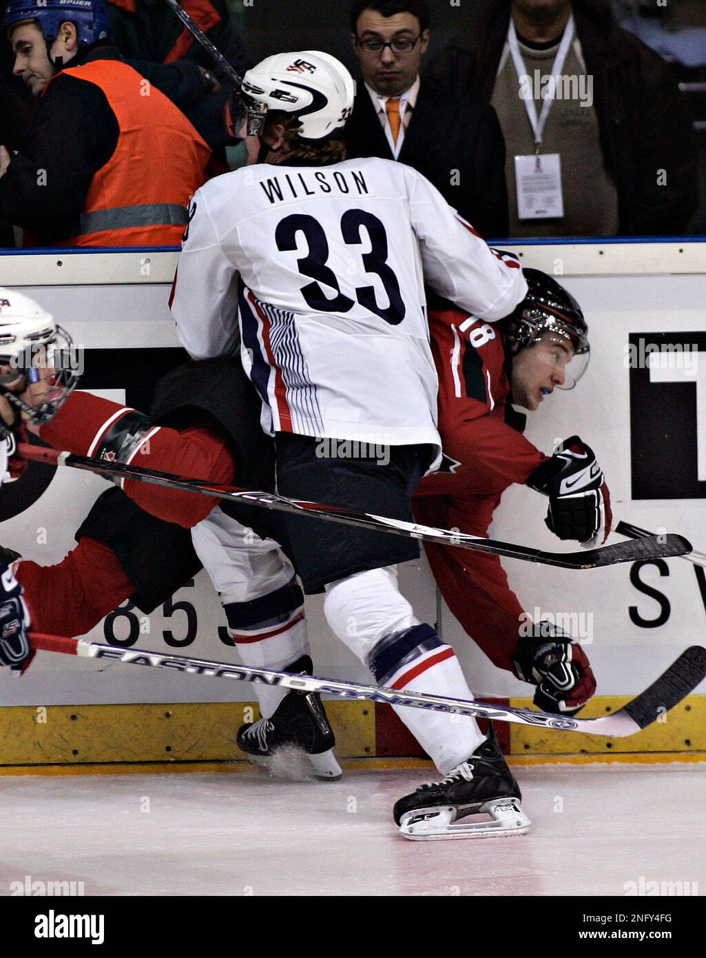 Team Canada Colton Gillies, of Surrey, B.C., is checked by Team USA