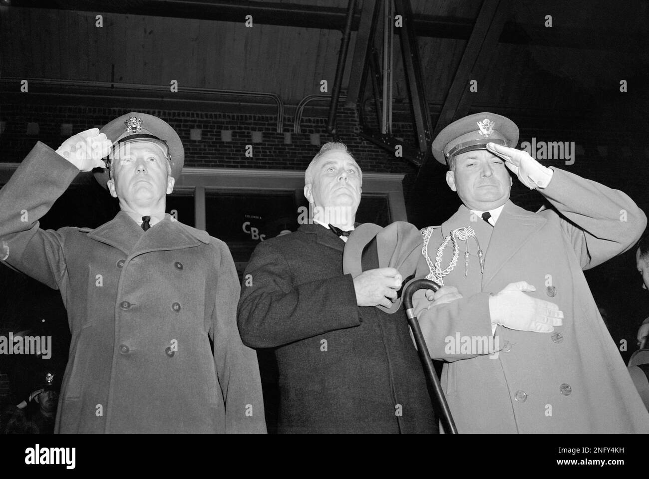 President Franklin Roosevelt ,center, is shown above with army officer ...