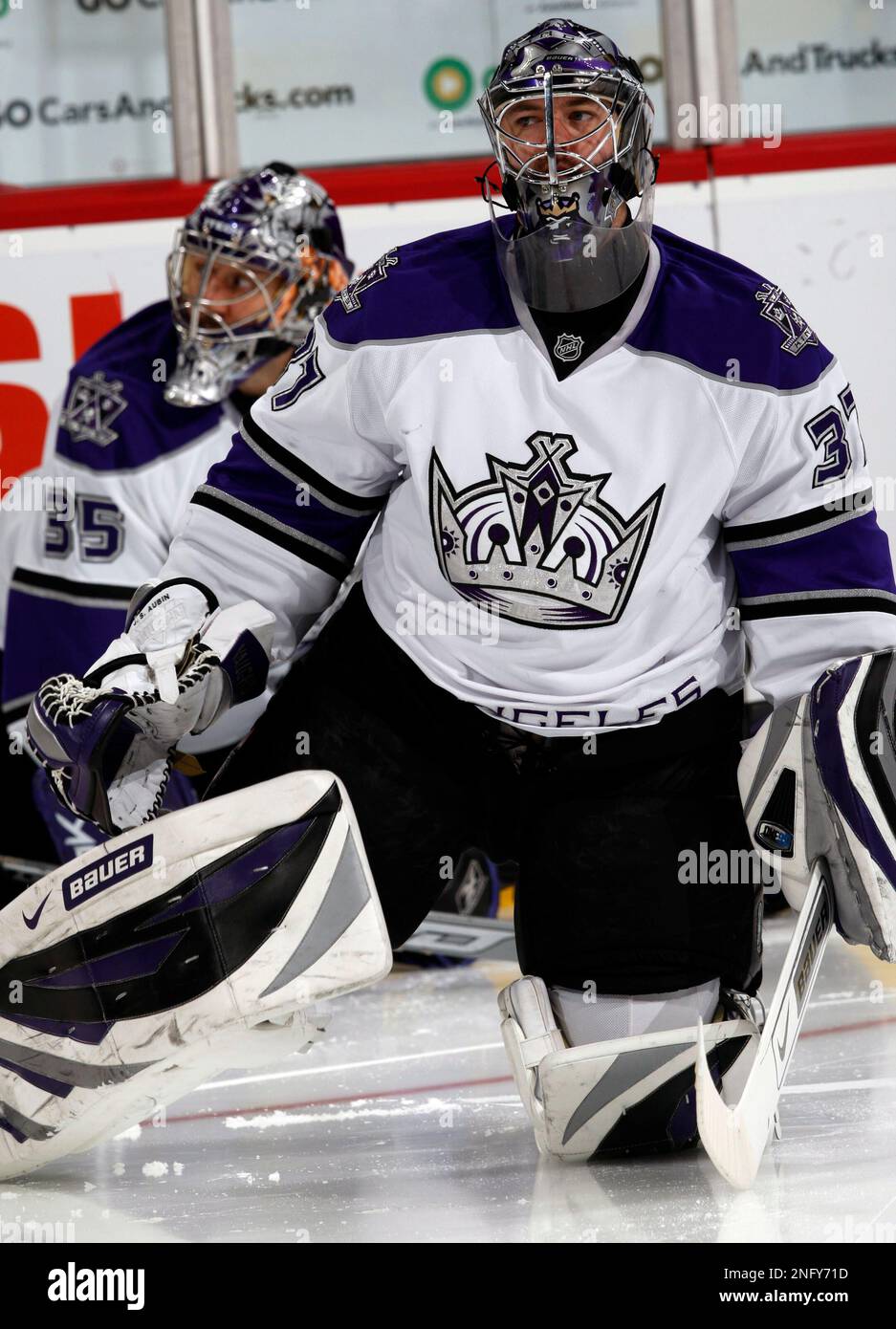 Los Angeles Kings goalies JeanSebastien Aubin, front, and Jason