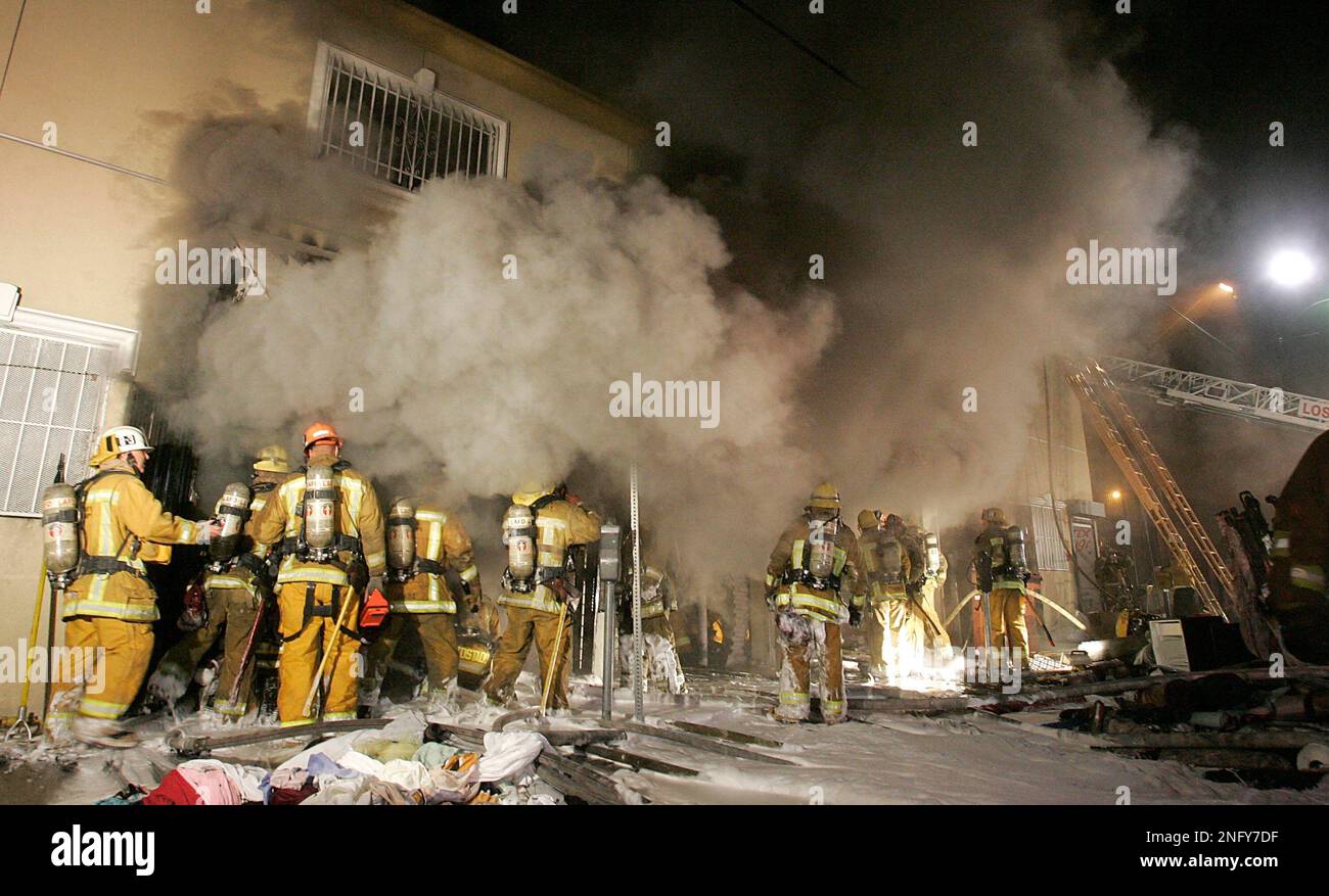 Los Angeles City firefighters battle a stubborn blaze in a textile ...