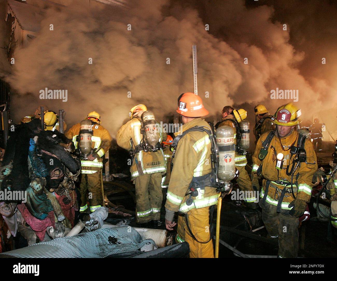 Los Angeles City firefighters battle a stubborn blaze in a textile