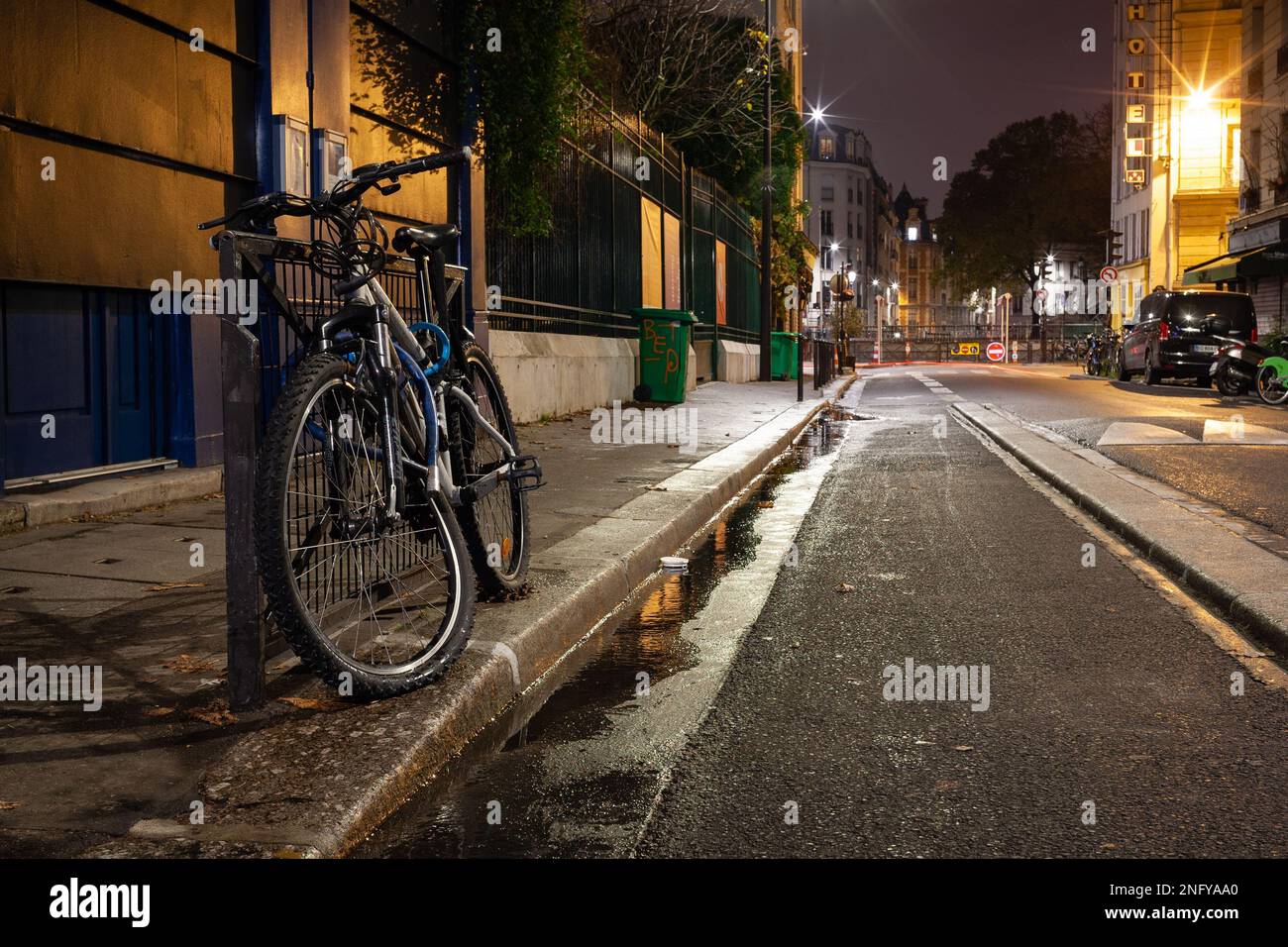 A broken bike on the side of a road Stock Photo