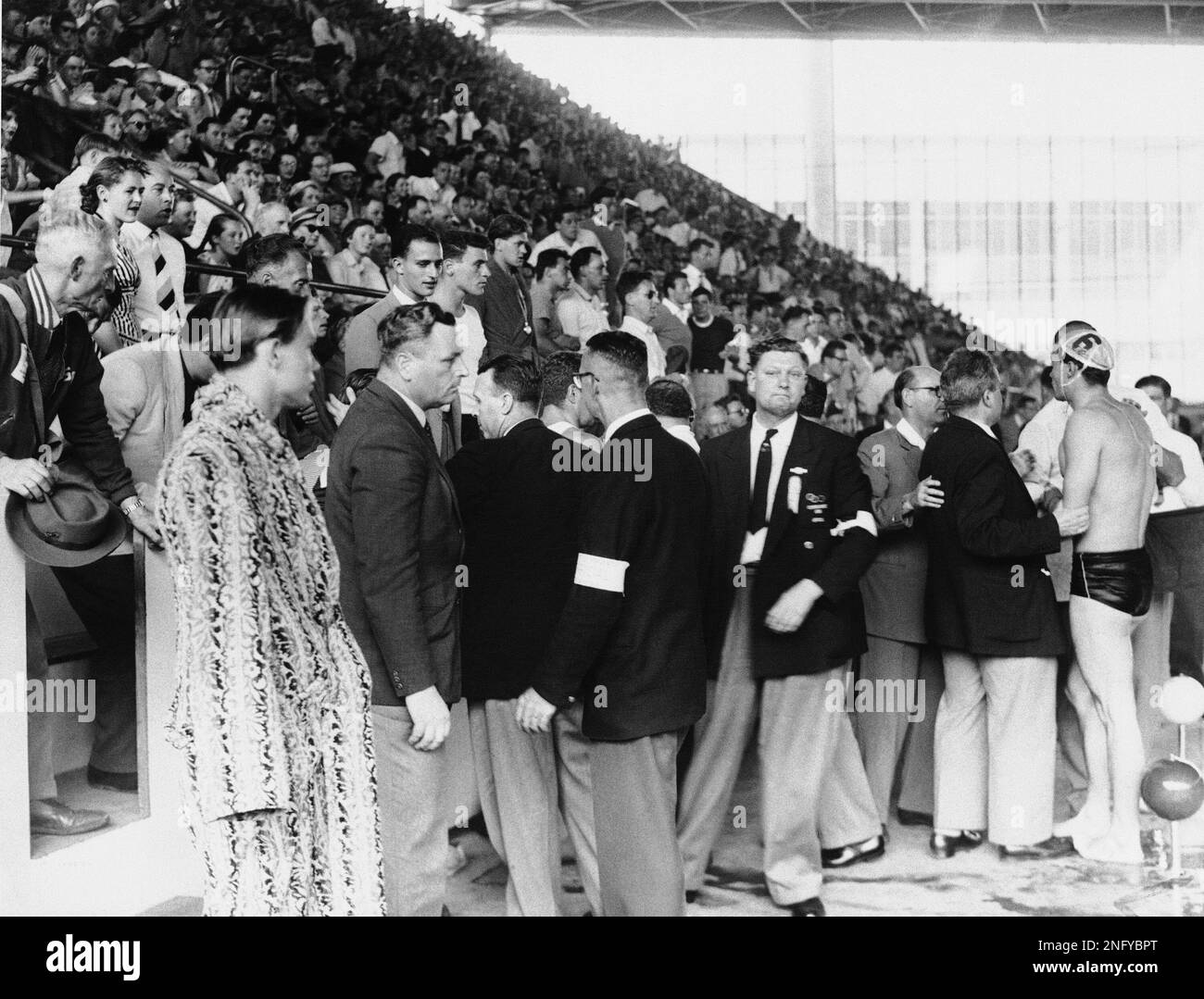 The crowd shouts and whistles at the Russian Water Polo team as the