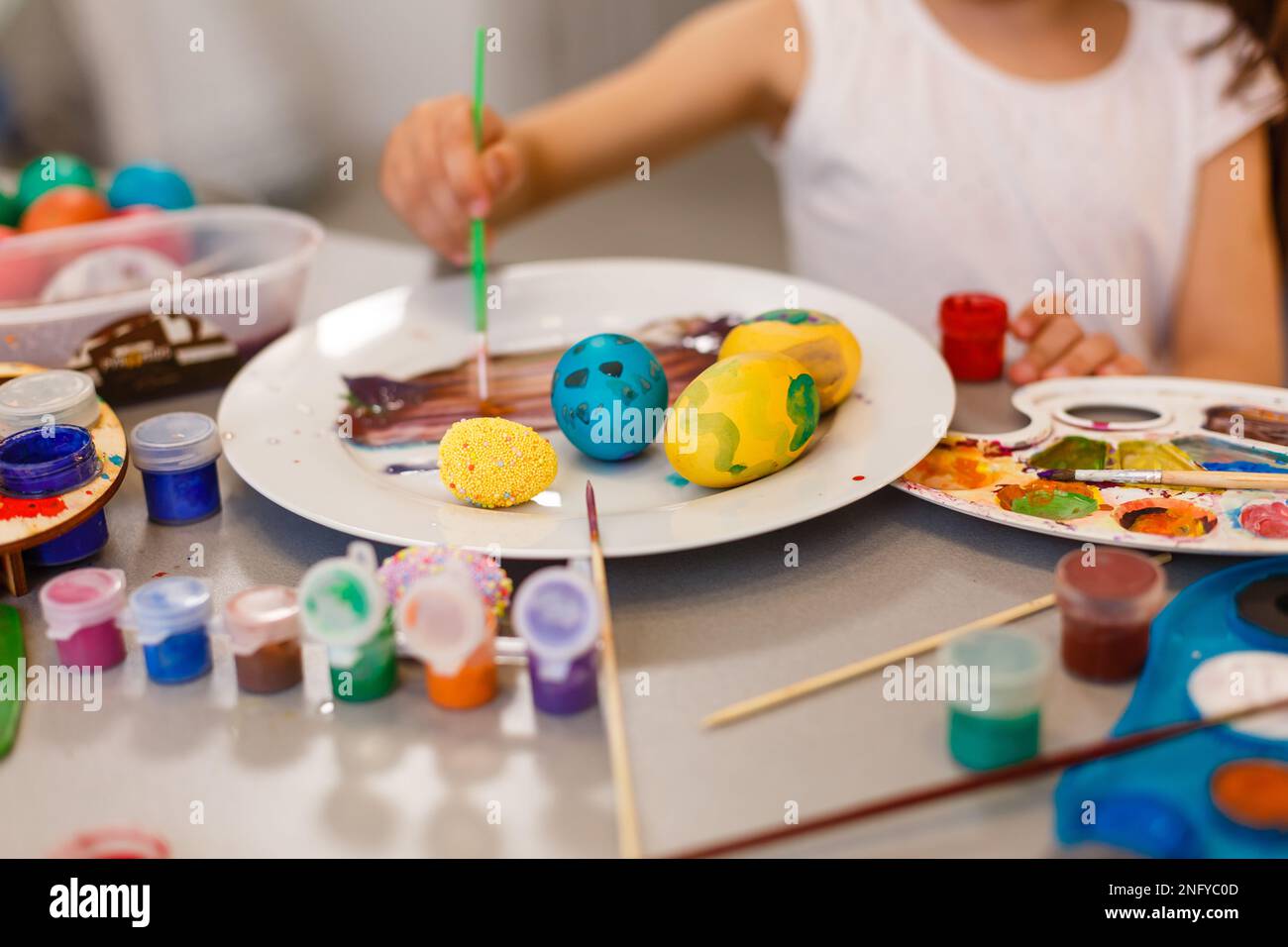 colouring eggs for eastertime at home Stock Photo