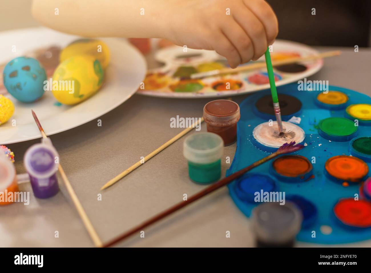 colouring eggs for eastertime at home Stock Photo