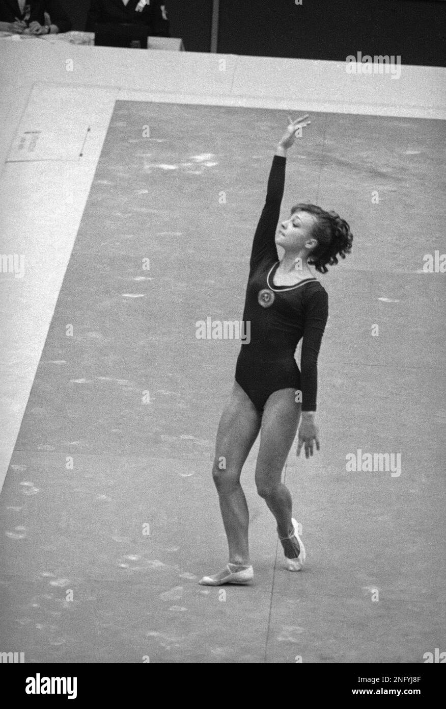 Russia's Natalia Kuchinskaya begins her compulsory floor exercises