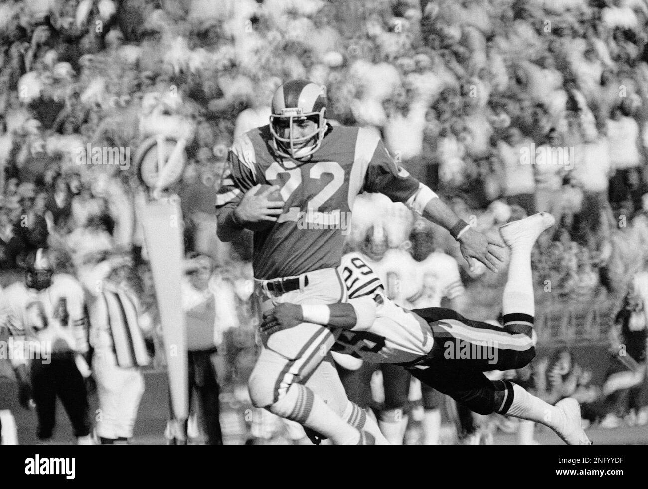 Los Angeles Rams back John Cappalletti gets stopped by a flying tackle from  New Orleans Saints Maurice Spencer during their game Sunday, Nov. 19, 1976  in Los Angles. The Rams beat the