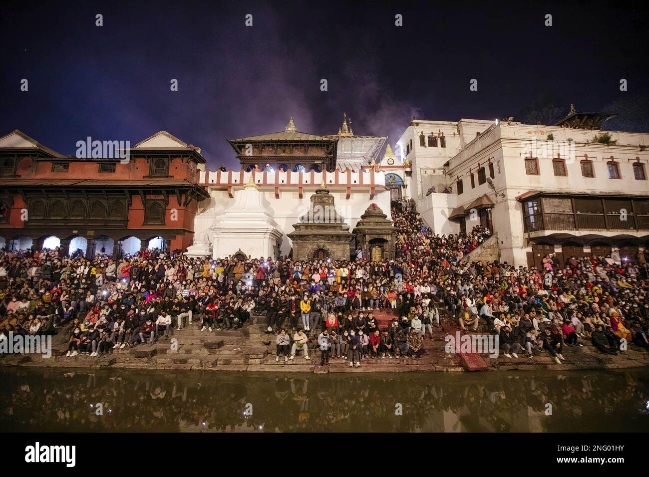 Kathmandu, Nepal. 17th Feb, 2023. Hindu devotees gather to observe the religious rituals and dance on the eve of the Maha Shivaratri festival at the premises of Pashupatinath Temple. Hindu Devotees from Nepal and India come to this temple to take part in the Shivaratri festival which is one of the biggest Hindu festivals dedicated to Lord Shiva and celebrated by devotees all over the world. Credit: SOPA Images Limited/Alamy Live News Stock Photo