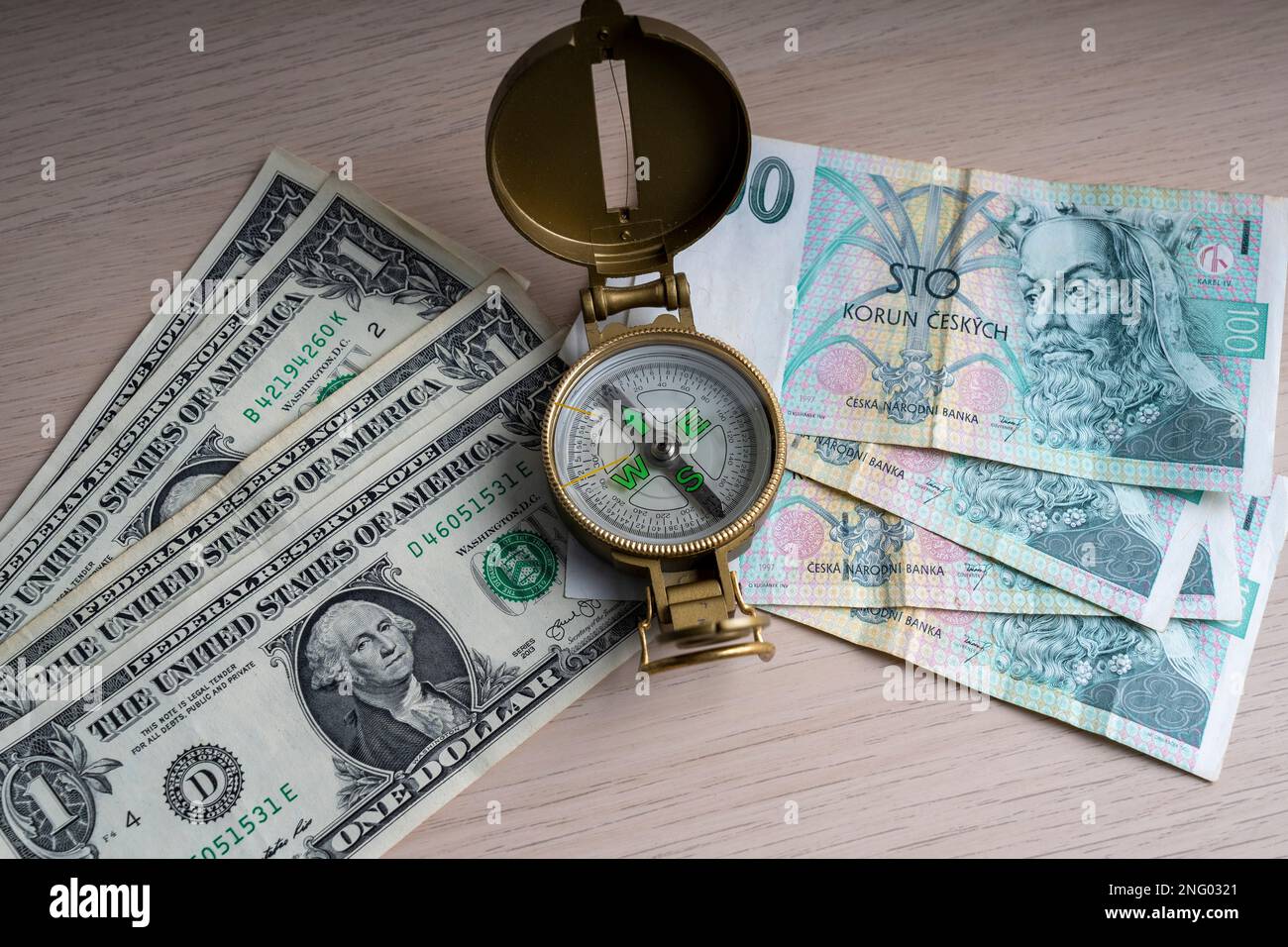 Czech Republic 100 korun paper banknote and US dollar 1. Czech currencies and compass currency indicator. Stock Photo
