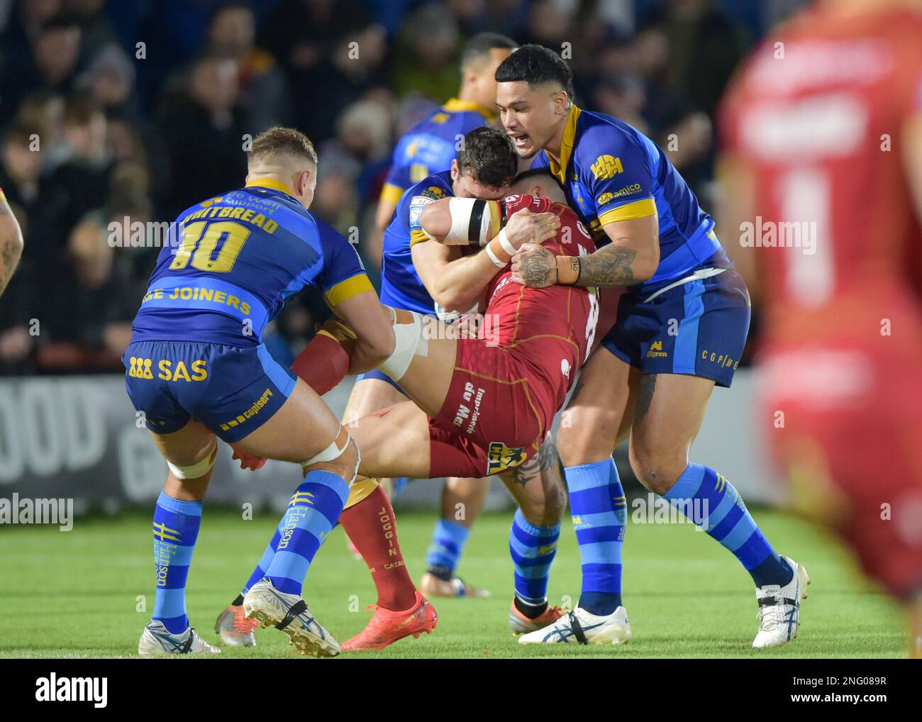 Wakefield, UK. 17th Feb, 2023. Romain Navarrete of Catalan Dragons tackled by Wakefield Trinity Wakefield Trinity v Catalan Dragons,  at the Bell vue, Wakefield, West Yorkshire, UK on the 17th February 2023  Photo Credit Craig Cresswell Photography Credit: Craig Cresswell/Alamy Live News Stock Photo